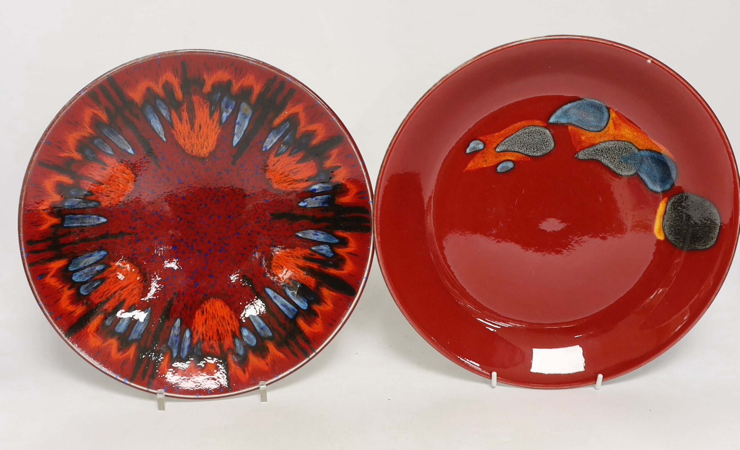Three Poole Pottery ‘Delphis’ wall plates, 25cm